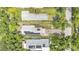 Bird's eye view of a home featuring solar panels, a driveway, and a well-manicured yard at 2218 Woodmere Rd, Venice, FL 34293