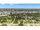 Wide aerial shot of the community showcasing the neighborhood, nearby amenities, and lush greenery at 2218 Woodmere Rd, Venice, FL 34293