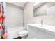 Bright bathroom with a shower/tub combo and a modern vanity at 2218 Woodmere Rd, Venice, FL 34293