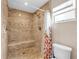 Elegant bathroom with a tiled shower, built-in bench, and modern fixtures at 2218 Woodmere Rd, Venice, FL 34293