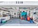 Organized garage with a workbench, storage shelves, and ample space at 2218 Woodmere Rd, Venice, FL 34293
