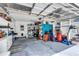 Spacious garage with ample storage and shelving for tools and equipment at 2218 Woodmere Rd, Venice, FL 34293