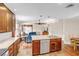 Bright, open kitchen featuring a spacious island and seamlessly flowing into the living area, enhancing the home's open concept at 2218 Woodmere Rd, Venice, FL 34293