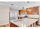 Well-equipped kitchen showcasing ample cabinet space, stainless steel appliances, and a large island with a sink at 2218 Woodmere Rd, Venice, FL 34293