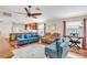 Open-concept living room with tile and wood floors, lots of space, and modern furnishings at 2218 Woodmere Rd, Venice, FL 34293