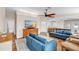 Open-concept living room with tile and wood floors, lots of space, and modern furnishings at 2218 Woodmere Rd, Venice, FL 34293
