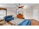 Comfortable living room with hardwood floors, a ceiling fan, and plenty of natural light at 2218 Woodmere Rd, Venice, FL 34293