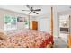 Inviting main bedroom showcases a ceiling fan, closet space and ensuite bathroom at 2218 Woodmere Rd, Venice, FL 34293