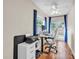 Bright home office with hardwood floors, backyard views, and a ceiling fan at 2218 Woodmere Rd, Venice, FL 34293