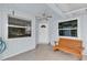 Enclosed patio area with a bench, natural light, and access to the outdoors at 2218 Woodmere Rd, Venice, FL 34293
