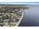 Picturesque waterfront home with lush greenery, seawall, and tranquil water views, located on the Gulf Coast at 2401 Riverview Blvd, Bradenton, FL 34205