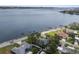 Waterfront property with lush landscaping, boat dock, and open water views providing a serene and coastal living experience at 2401 Riverview Blvd, Bradenton, FL 34205