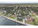 Gorgeous waterfront home nestled among mature trees, with a convenient dock and serene water views and coastal charm at 2401 Riverview Blvd, Bradenton, FL 34205