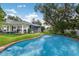 Backyard with a refreshing pool and outdoor seating area at 2401 Riverview Blvd, Bradenton, FL 34205