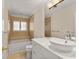Bright bathroom with a tub and shower combination, modern vanity, and neutral color scheme at 2401 Riverview Blvd, Bradenton, FL 34205