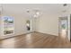 Bedroom featuring natural light from two windows with views of the neighborhood and water at 2401 Riverview Blvd, Bradenton, FL 34205