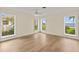Bright bedroom with lake views from the multiple windows providing natural light at 2401 Riverview Blvd, Bradenton, FL 34205