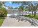 Spacious home featuring an attached garage, long driveway and waterfront views at 2401 Riverview Blvd, Bradenton, FL 34205
