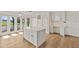 Bright kitchen island and eat-in area with seamless flow to outdoor entertainment area at 2401 Riverview Blvd, Bradenton, FL 34205
