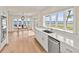 Kitchen featuring sleek countertops, stainless appliances and water view dining area at 2401 Riverview Blvd, Bradenton, FL 34205