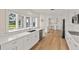 Kitchen featuring sleek countertops, modern appliances, and a water view at 2401 Riverview Blvd, Bradenton, FL 34205