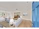 Open concept living room with hardwood floors and plenty of natural light at 2401 Riverview Blvd, Bradenton, FL 34205