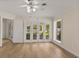 Bright room with hardwood floors and windows and French doors with back yard views at 2401 Riverview Blvd, Bradenton, FL 34205