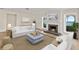 Comfortable living room featuring a fireplace and water views at 2401 Riverview Blvd, Bradenton, FL 34205