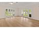 Spacious living room featuring hardwood floors and French doors to a backyard view at 2401 Riverview Blvd, Bradenton, FL 34205