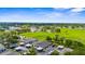 Scenic aerial view of townhomes with carports and green space for a relaxing community atmosphere at 2915 29Th W Ave, Bradenton, FL 34205