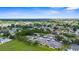 Aerial view of townhomes and carports in a quiet neighborhood setting surrounded by green space at 2915 29Th W Ave, Bradenton, FL 34205