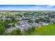 Aerial view of townhomes and carports nestled in a lush, green residential neighborhood at 2915 29Th W Ave, Bradenton, FL 34205