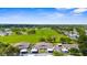 Wide aerial shot of townhomes with carports surrounded by green space for outdoor activities at 2915 29Th W Ave, Bradenton, FL 34205