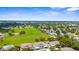 Panoramic aerial view showcases townhomes, pool, and community green space in lush neighborhood at 2915 29Th W Ave, Bradenton, FL 34205