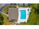 Birds eye view of a community pool featuring an abundance of lounge chairs and covered tables at 2915 29Th W Ave, Bradenton, FL 34205