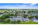 Aerial view showcasing townhomes with convenient carports, surrounded by lush greenery and mature trees at 2915 29Th W Ave, Bradenton, FL 34205