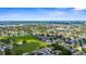 Stunning aerial view of a townhome community adjacent to a green space and residential area at 2915 29Th W Ave, Bradenton, FL 34205