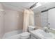 Bathroom featuring a shower-tub combo and a large mirror at 2915 29Th W Ave, Bradenton, FL 34205