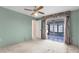Bedroom features plush carpeting and a sliding glass door to the outdoor patio at 2915 29Th W Ave, Bradenton, FL 34205