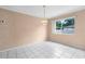 Bright dining room features neutral walls, tile flooring, and a chandelier at 2915 29Th W Ave, Bradenton, FL 34205