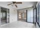 Enclosed lanai featuring tile floors, sliding glass door access to the exterior and living room at 2915 29Th W Ave, Bradenton, FL 34205