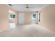 Comfortable living room with carpet, neutral paint, ceiling fan, and view to the entry at 2915 29Th W Ave, Bradenton, FL 34205