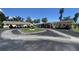 Well-maintained community with carports and mature trees, providing a serene and comfortable living environment at 3032 Heron Lake Ct # 7B, Venice, FL 34293