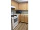Practical kitchen featuring ample cabinetry and efficient appliances, designed for convenient meal preparation at 3032 Heron Lake Ct # 7B, Venice, FL 34293