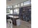 Community library featuring reading area, books and an assortment of titles at 3032 Heron Lake Ct # 7B, Venice, FL 34293