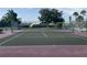 Community tennis court with new nets and fencing in a quiet park setting at 3032 Heron Lake Ct # 7B, Venice, FL 34293