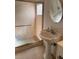 Bathroom with shower, glass door, sink, faucet, mirror, and tile floor at 3404 56Th Dr E, Bradenton, FL 34203