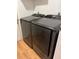 Well-lit laundry area featuring a modern, front-loading washer and dryer set at 3404 56Th Dr E, Bradenton, FL 34203