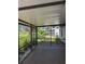 Cozy screened-in lanai perfect for enjoying views of the home's private backyard at 3404 56Th Dr E, Bradenton, FL 34203