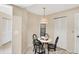 Cozy breakfast nook with a table and chairs by a window at 3617 Yellow Pine Ct # 144, Sarasota, FL 34238